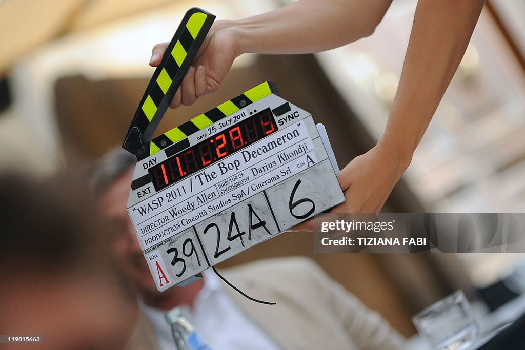 An assistant gets ready withe clapper-bo