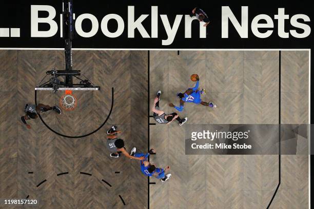 Dennis Schroder of the Oklahoma City Thunder carries the ball against Rodions Kurucs of the Brooklyn Nets at Barclays Center on January 07, 2020 in...