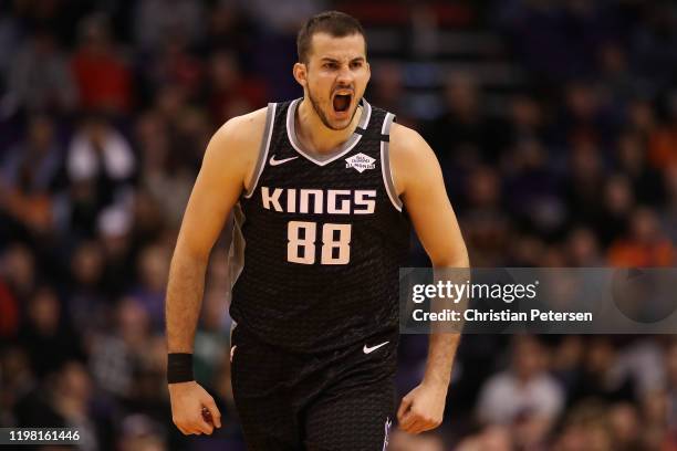 Nemanja Bjelica of the Sacramento Kings reacts after hitting a three point shot against the Phoenix Suns during the second half the NBA game at...