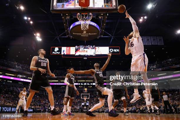 Aron Baynes of the Phoenix Suns attempts a shot over Harry Giles III of the Sacramento Kings during the first half the NBA game at Talking Stick...