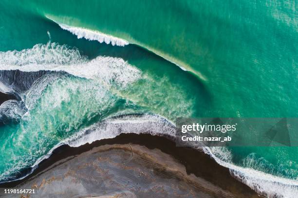 textured effect of waves breaking on bank. - new zealand aerial stock pictures, royalty-free photos & images