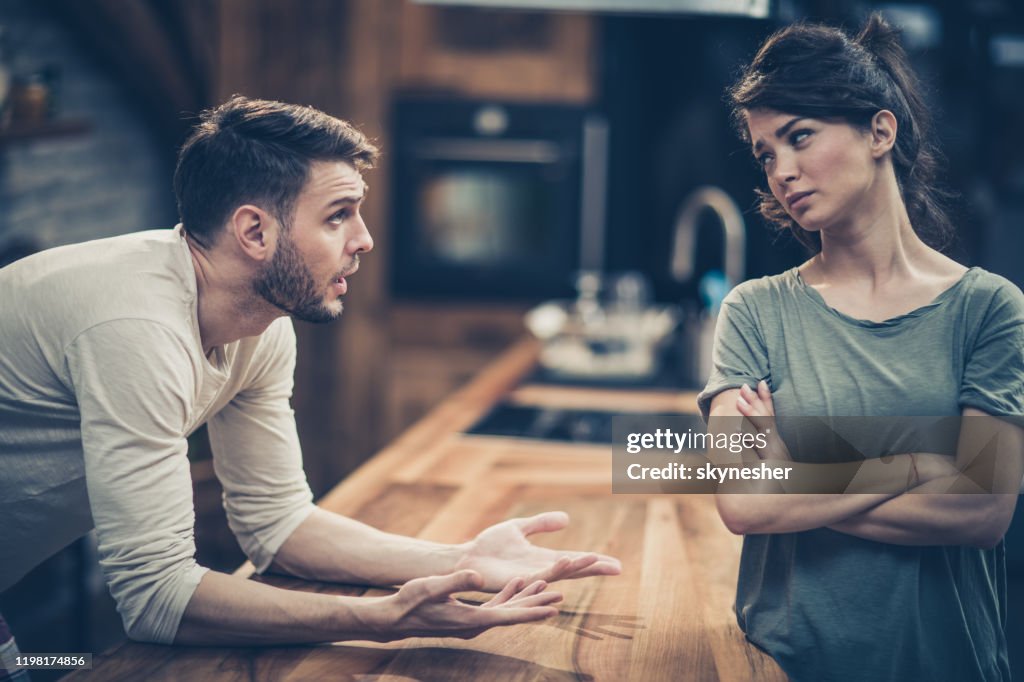 Young couple arguing while having problems in their relationship.