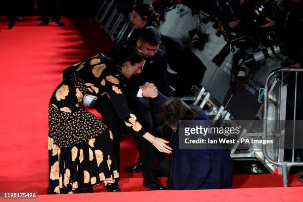 Al Pacino is helped to his feet after falling over whilst attending the 73rd British Academy Film Awards held at the Royal Albert Hall, London.