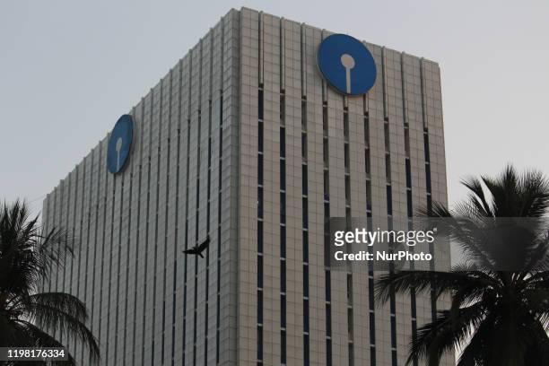 Bird flies past the State Bank of India building in Mumbai, India on 02 February 2020.