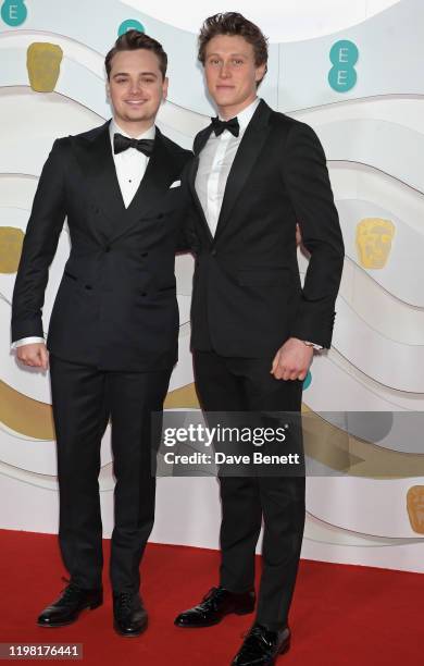 Dean-Charles Chapman and George MacKay arrive at the EE British Academy Film Awards 2020 at Royal Albert Hall on February 2, 2020 in London, England.