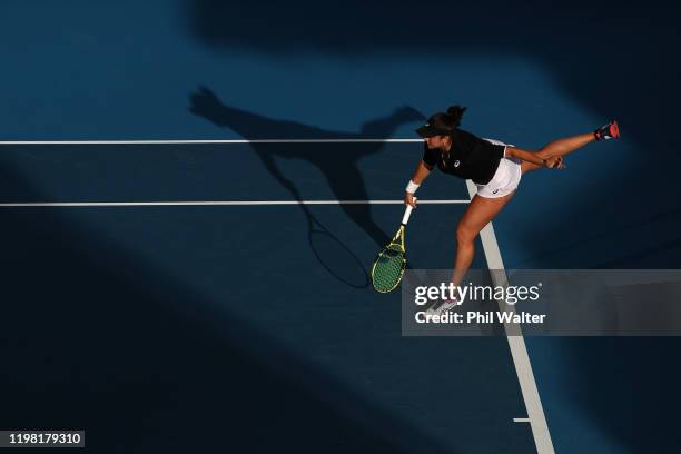 Caroline Dolehide of the USA serves with Johanna Larsson of Sweden during their doubles match against Caroline Wozniacki of Denmark and Serena...