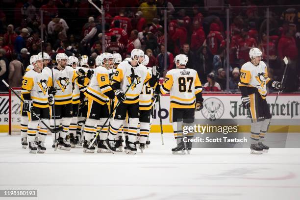 Sidney Crosby of the Pittsburgh Penguins celebrates with teammates after the game against the Washington Capitals at Capital One Arena on February 2,...