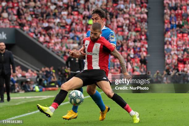 Iñigo Martínez, #4 of Athletic Bilbao defended by Damián, #22 of Getafe CF during the Athletic Bilbao V Getafe CF, J22 La Liga regular season match...