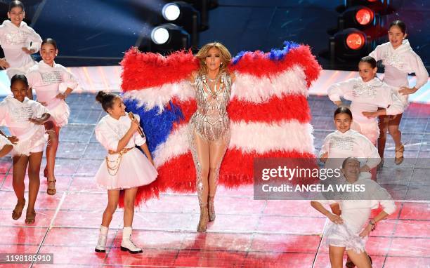 Singer Jennifer Lopez and her daughter Emme Muniz perform during the halftime show of Super Bowl LIV between the Kansas City Chiefs and the San...