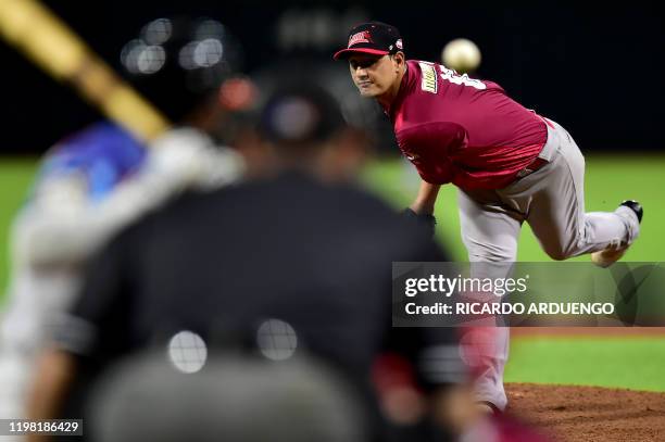 Venezuela's starting pitcher Wilfredo Ledezma throws during the first inning during a Caribbean Series baseball game against the Dominican Republic...