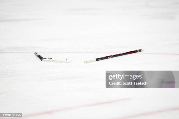 Broken stick is seen on the ice during the third period of the game between the Washington Capitals and the Pittsburgh Penguins at Capital One Arena...