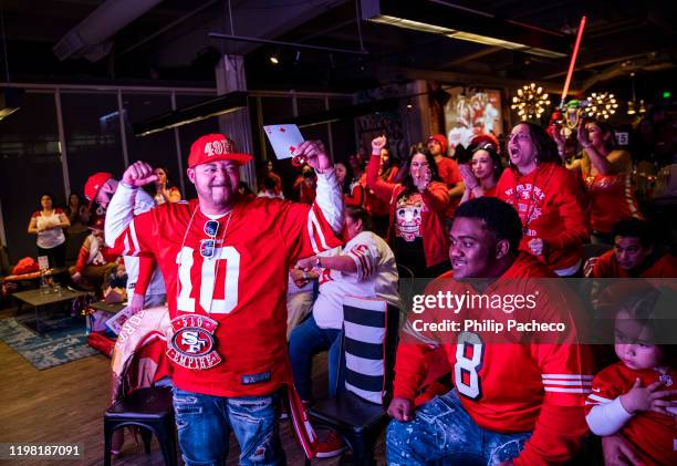 Trae Beauchamp of Oakland, California reacts while watching the San Francisco 49ers play the Kansas City Chiefs during a Super Bowl LIV watch party...