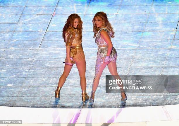 Singer Jennifer Lopez and Colombian singer Shakira perform during the halftime show of Super Bowl LIV between the Kansas City Chiefs and the San...