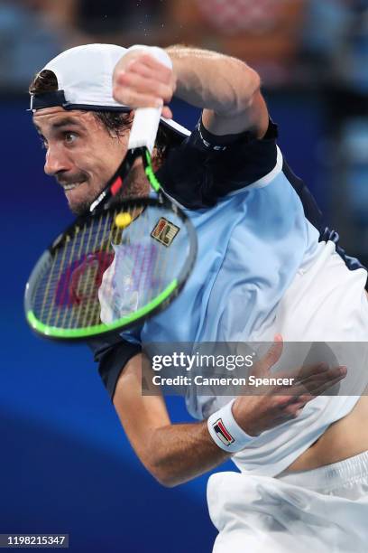 Guido Pella of Argentina serves during his Group E singles match against Marin Cilic of Croatia during day six of the 2020 ATP Cup Group Stage at Ken...