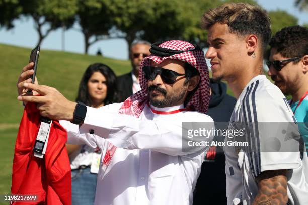 Philippe Coutinho poses for a picture with a fan during day five of the FC Bayern Muenchen winter training camp at Aspire Academy on January 08, 2020...