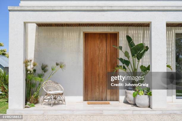 modern home front door and porch in buenos aires - alpendre imagens e fotografias de stock