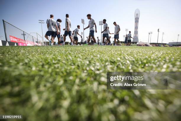 Players warm up during a training session on day five of the FC Bayern Muenchen winter training camp at Aspire Academy on January 08, 2020 in Doha,...