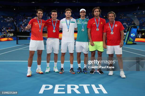 Rafael Nadal, Roberto Bautista Agut, Pablo Carreno Busta, Albert Ramos-Vinolas, Feliciano Lopez and Francisco Roig of Team Spain pose after winning...