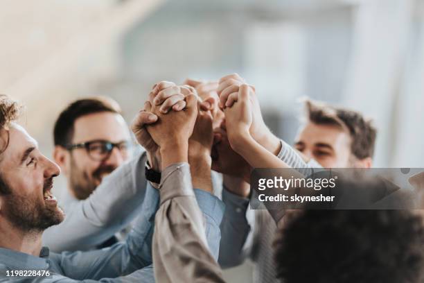 sea of hands in unity! - teamwork stock pictures, royalty-free photos & images