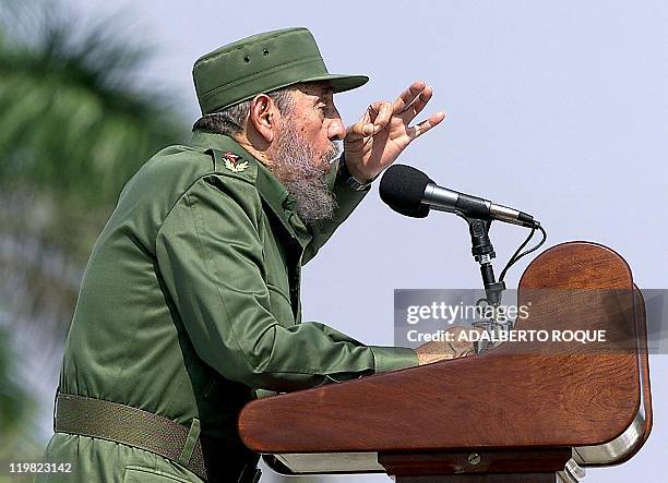 Cuban President Fidel Castro gives a speech to the crowd in Havana's Revolution Square, packed with a morass of Cubans wearing red and white T-shirts...