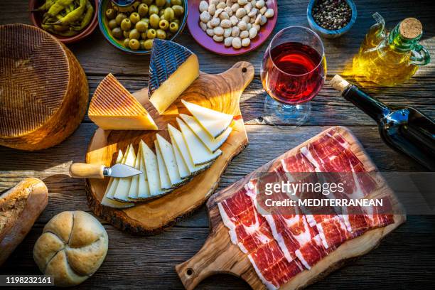 tapas from spain food iberian ham cheese wine - tapas stock pictures, royalty-free photos & images
