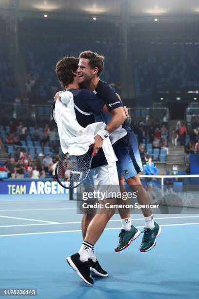 Diego Schwartzman of Argentina celebrates with Guido Pella of Argentina after winning his Group E singles match against Borna Coric of Croatia during...