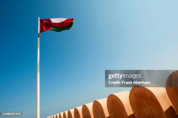 national flag of oman - omani flag stock pictures, royalty-free photos & images