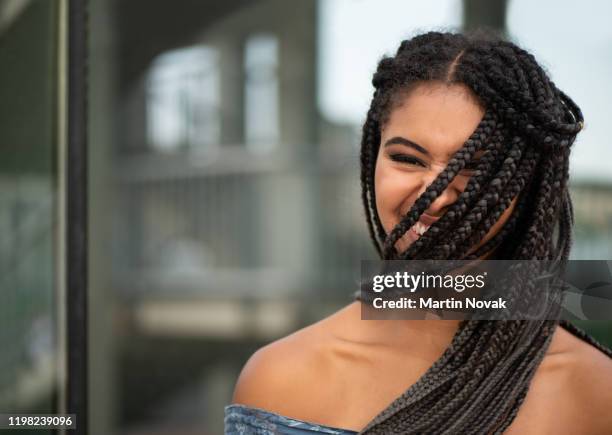 stylish cheerful black teenager with jumbo hairstyle - african american women in the wind stock pictures, royalty-free photos & images