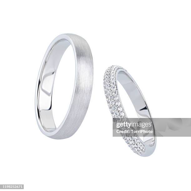 silver wedding rings with diamonds isolated on white - anillo joya fotografías e imágenes de stock