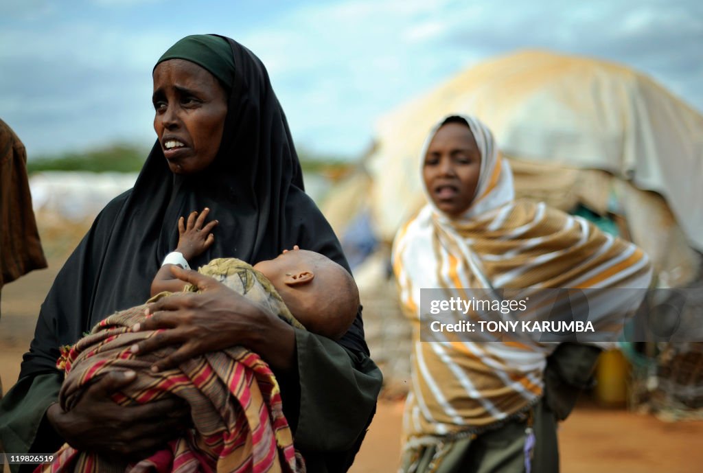 A displaced Somali refugee cradles her s