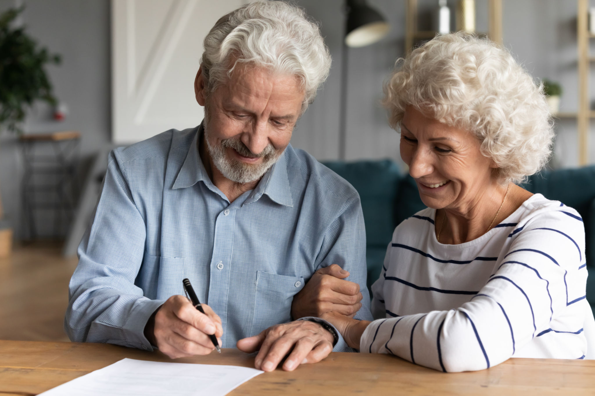 60s elderly spouses at lawyer office sign marriage contract 60s elderly spouses at lawyer office sign marriage contract