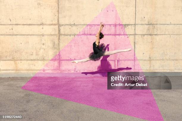 creative picture of ballerina stands out from pink triangle shape. - 古典様式　壁 ストックフォトと画像