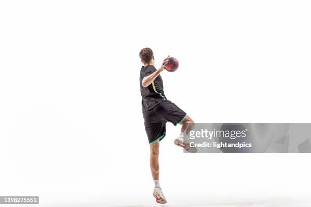 handball player in studio - handball stock pictures, royalty-free photos & images