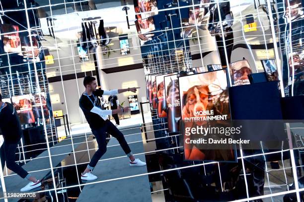 An attendee poses inside the The Sero tunnel display at the Samsung booth during CES 2020 at the Las Vegas Convention Center on January 8, 2020 in...