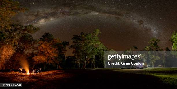 camping under the milky way with a lovely campfire in rural australia. - campfire stock pictures, royalty-free photos & images