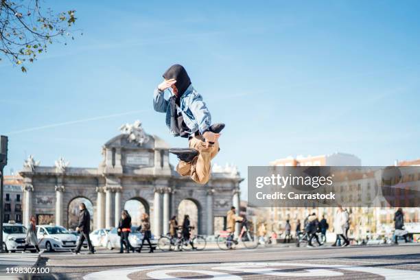 hip hop dancer man jumping in the city of madrid spain. - hip hopper stock pictures, royalty-free photos & images