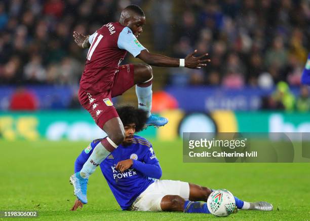 Hamza Choudhury of Leicester City battles for the ball with Marvelous Nakamba of Aston Villa during the Carabao Cup Semi Final match between...
