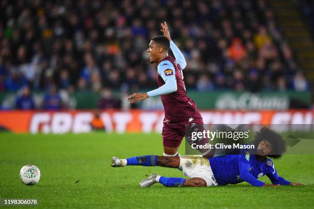 Ezri Konsa of Aston Villa battles for the ball with Hamza Choudhury of Leicester City during the Carabao Cup Semi Final match between Leicester City...