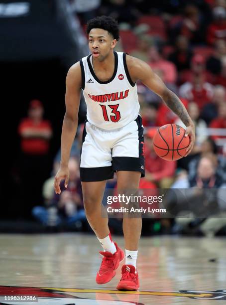 David Johnson of the Louisville Cardinals dribbles the ball during the game against the Miami Hurricanes at KFC YUM! Center on January 07, 2020 in...