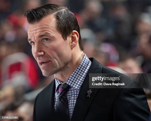 Assistant coach Luke Richardson of the Montreal Canadiens watches the action from the bench against the Detroit Red Wings during an NHL game at...