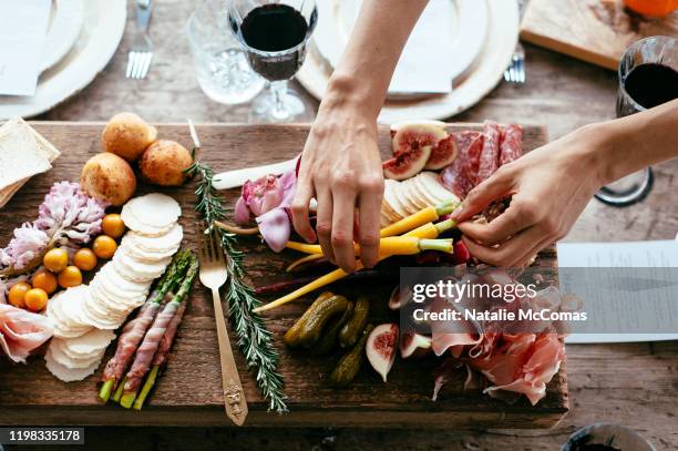 platter of fresh antipasto food at a party - accompagnement photos et images de collection