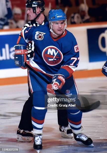 Pierre Turgeon of the New York Islanders skates against the Toronto Maple Leafs during NHL game action on December 11, 1991 at Maple Leaf Gardens in...