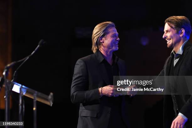 Brad Pitt accepts the award for Best Supporting Actor for Once Upon A Time... In Hollywood from Bradley Cooper onstage during The National Board of...
