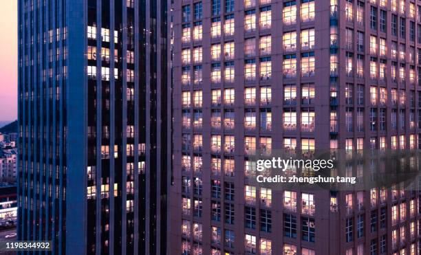 dusk view of office building, dalian, china. - lisa tang imagens e fotografias de stock