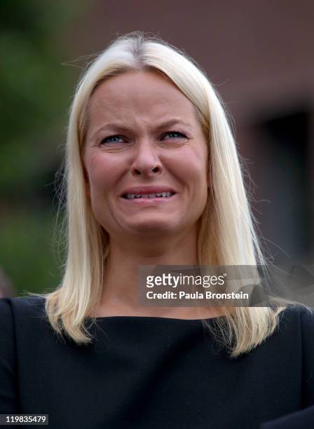 Crown Princess Mette-Marit of Norway cries as thousands of people gather at a memorial vigil following Friday's twin extremist attacks on July 25...