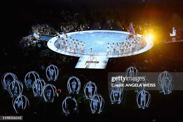 Singer Jennifer Lopez and her daughter Emme Muniz perform during the halftime show of Super Bowl LIV between the Kansas City Chiefs and the San...