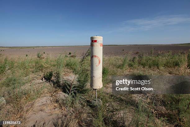 Buoy, which alerts boater of a no-wake zone, rests on the dry bed of O.C. Fisher Lake on July 25, 2011 in San Angelo, Texas. The 5,440 acre lake...