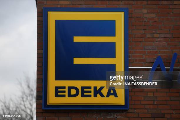 Picture taken on February 3, 2020 shows a logo at the entrance of an Edeka supermarket in Dortmund, Germany.