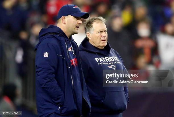 Head coach Bill Belichick of the New England Patriots talks with Special Teams Coordinator Joe Judge in the AFC Wild Card Playoff game against the...