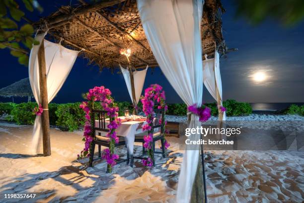 dinner at the beach - beach pavilion stock pictures, royalty-free photos & images